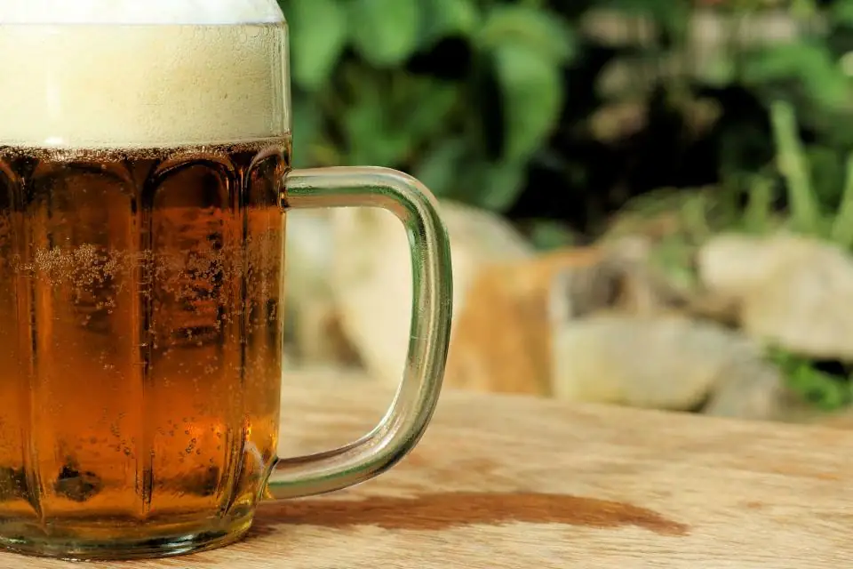 A frosty mug of lager outdoors