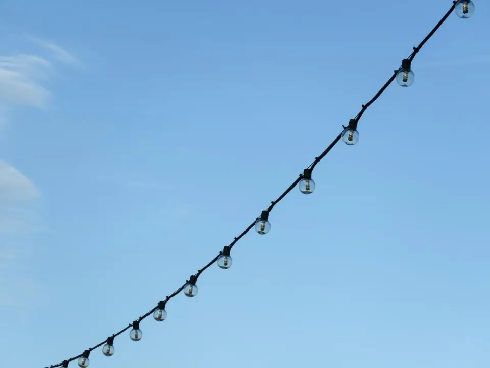 String lights against a blue sky